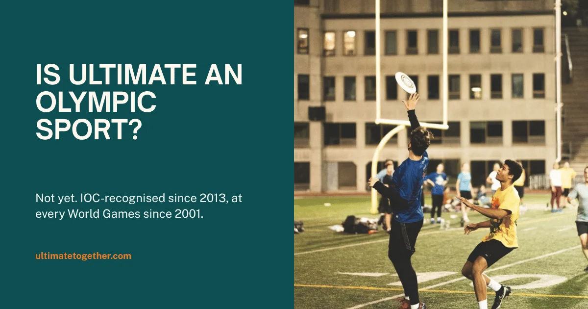 Ultimate frisbee players competing for a disc on a floodlit field