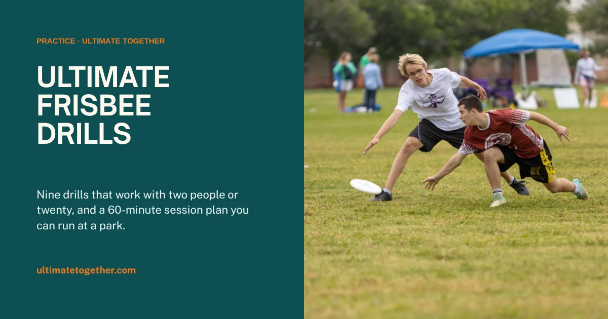 Two ultimate frisbee players contesting a disc during a practice drill on grass